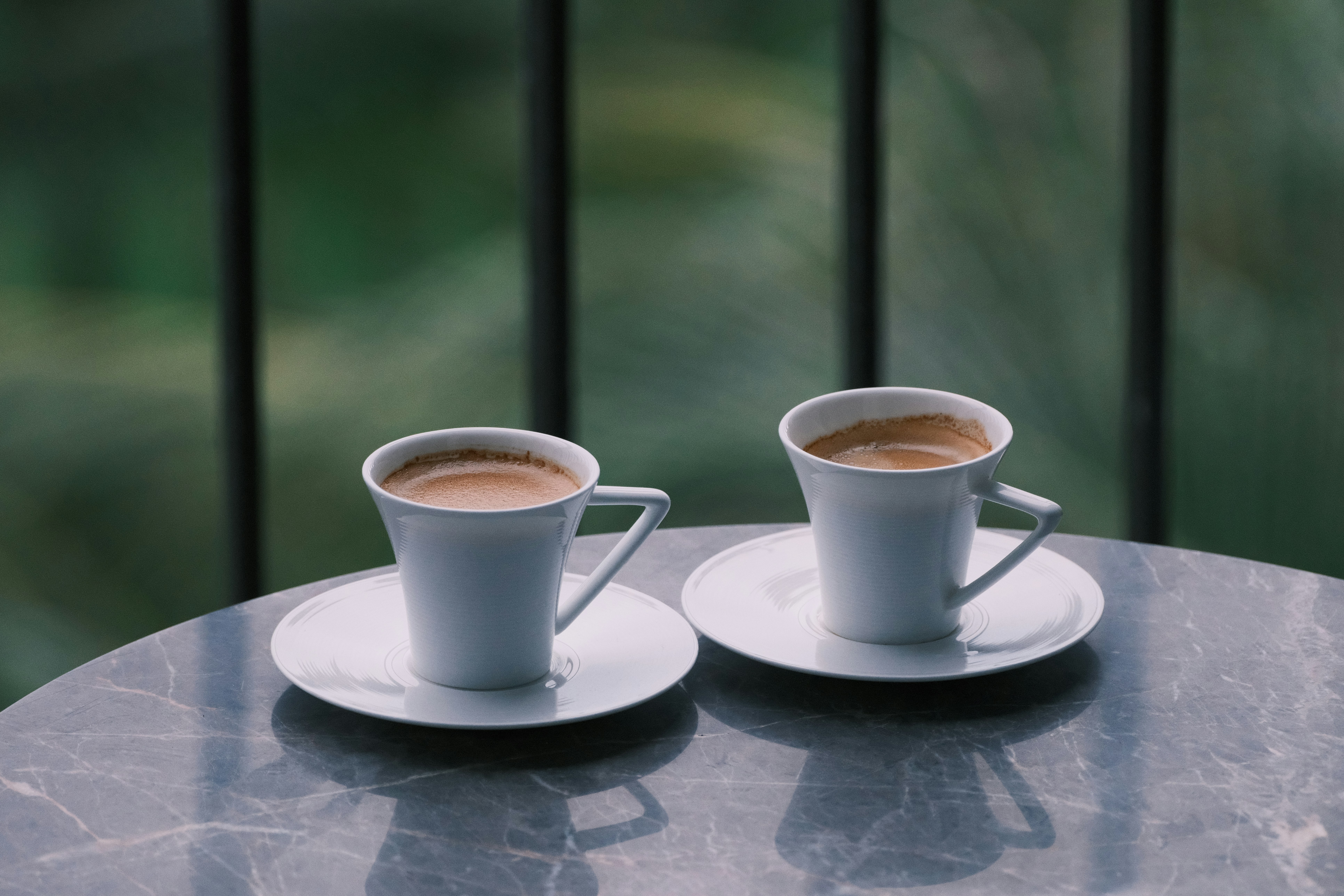 Two Cups of Espresso on a Table